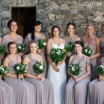 Wedding Party in Courtyard by Stone Wall